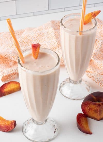 Peaches, lemon, lemonade and vanilla ice cream in a milkshake.