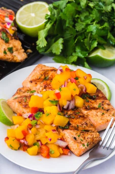 Salmon cooked on the grill with a mango tropical salsa.