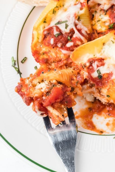 A bite of cheese stuffed chicken shells.