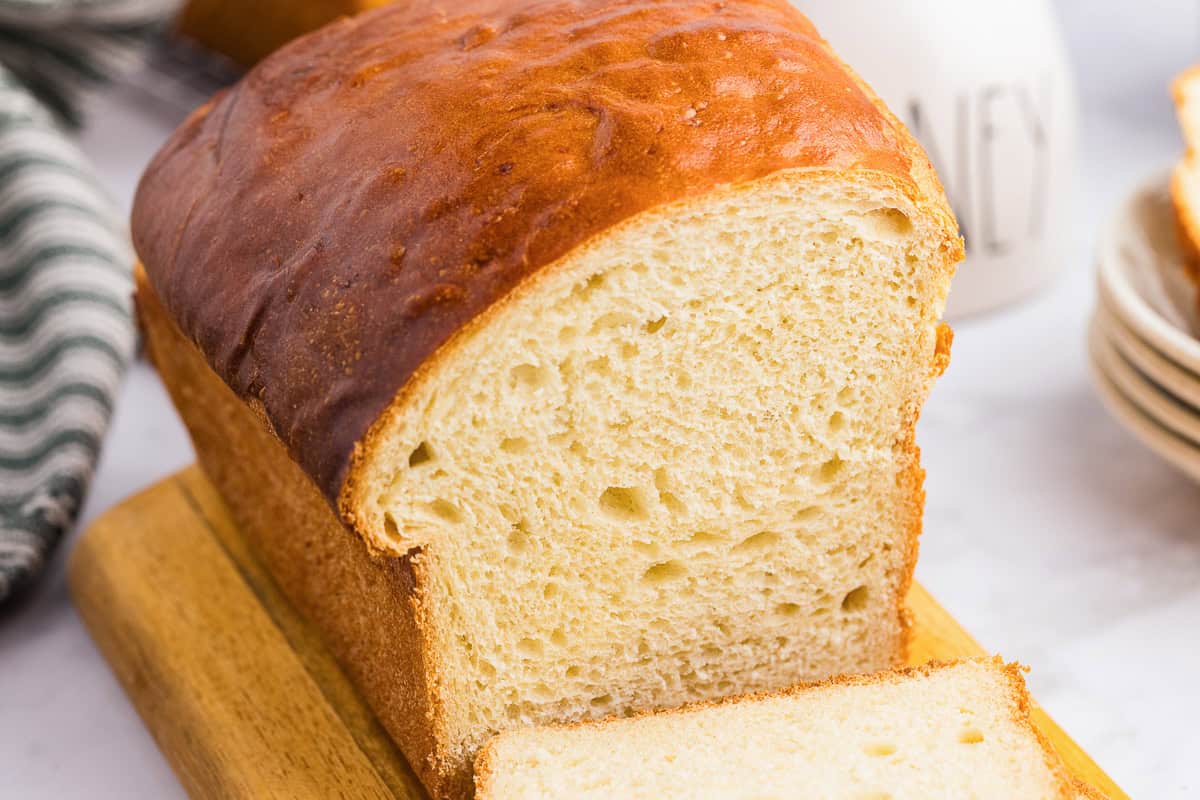 A loaf of easy Potato Bread on a cutting board.