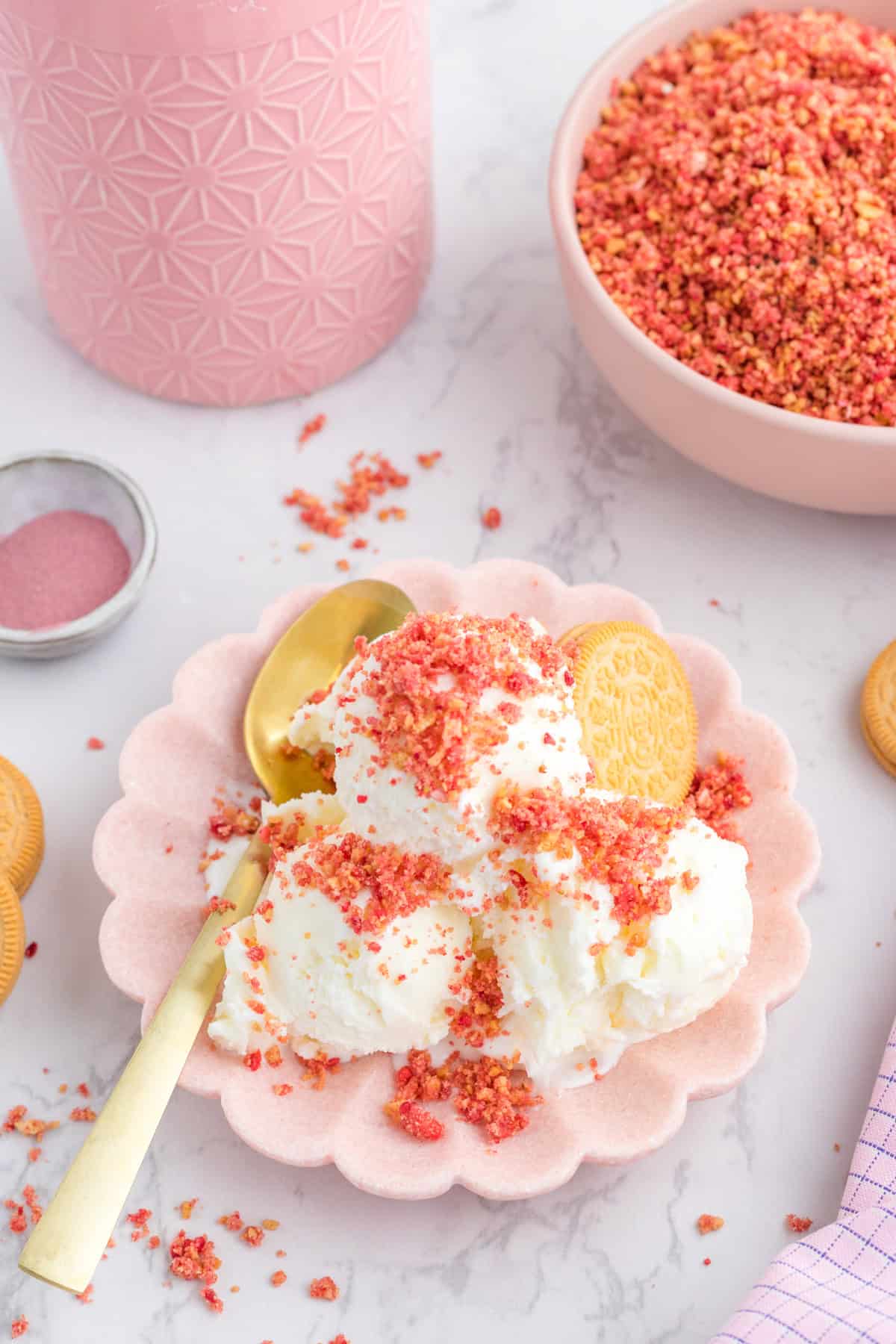A flavored topping on top of a bowl of vanilla ice cream.