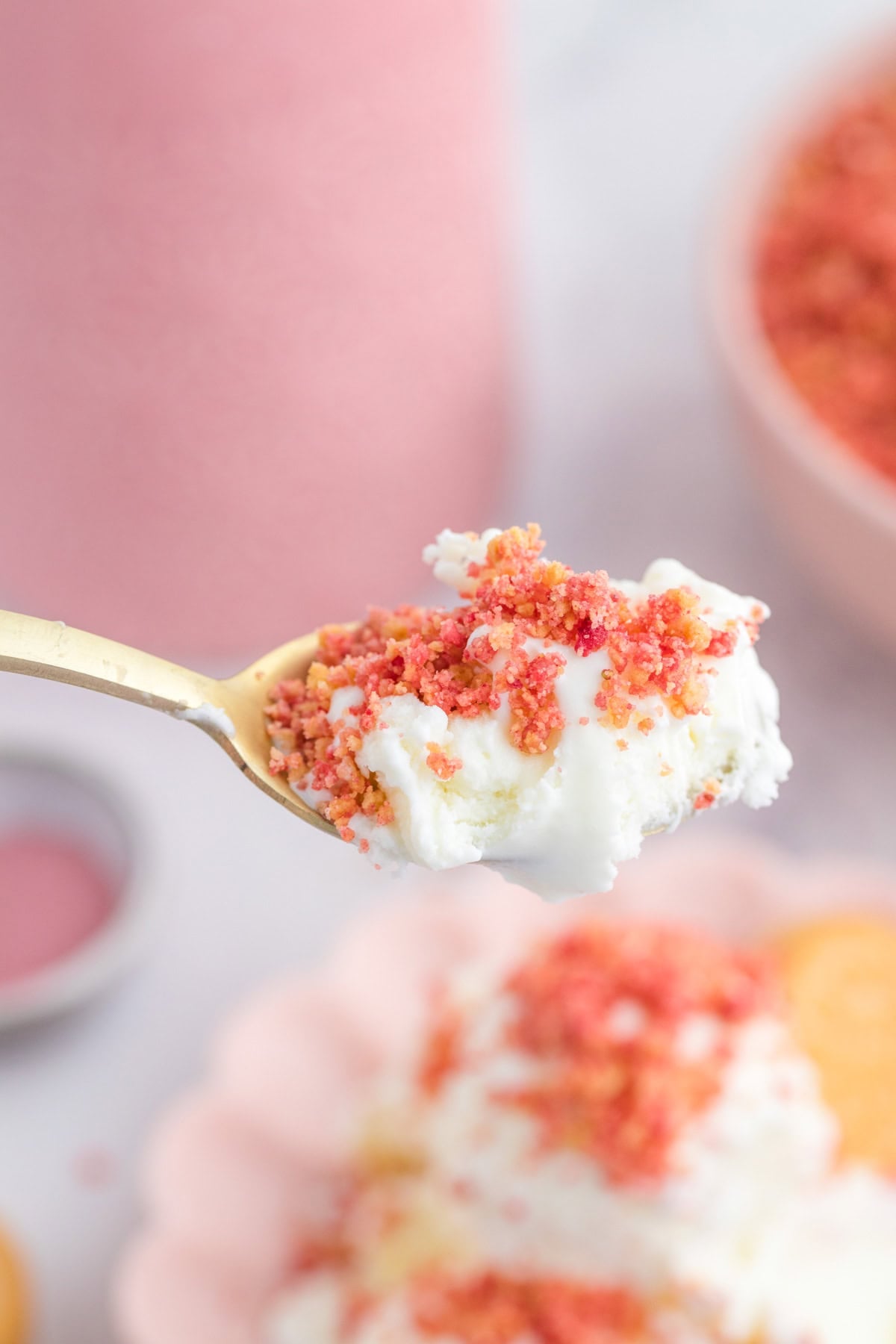A bite of ice cream with a crunchy fruity topping.