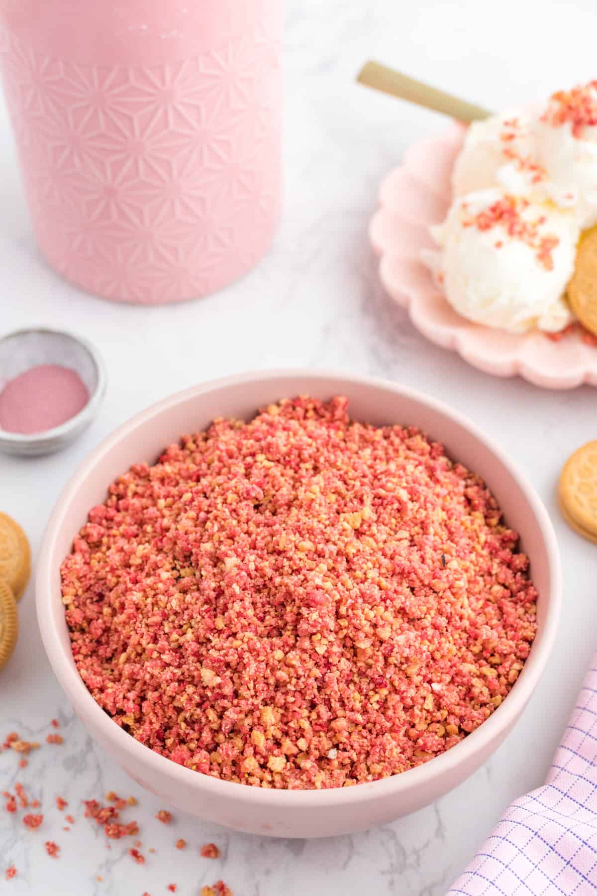 A bowl of strawberry ice cream topping