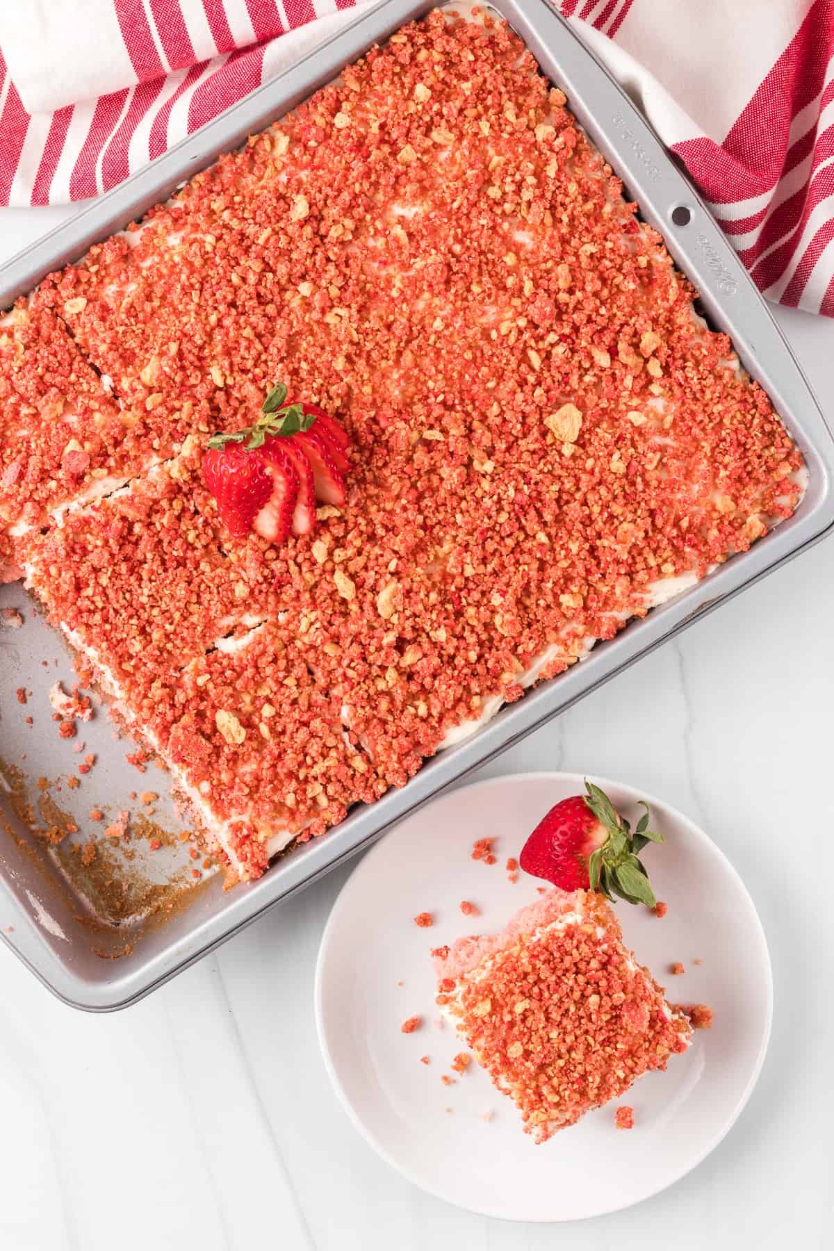 The top of a decorated strawberry cake.