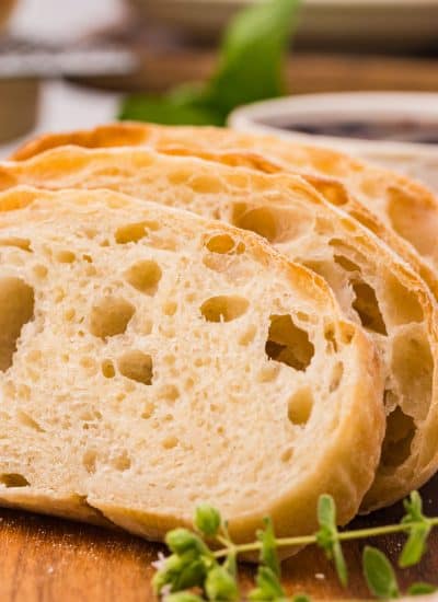 Slices of Ciabatta on a cutting board.