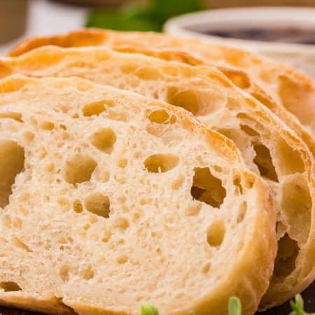 Slices of Ciabatta on a cutting board.