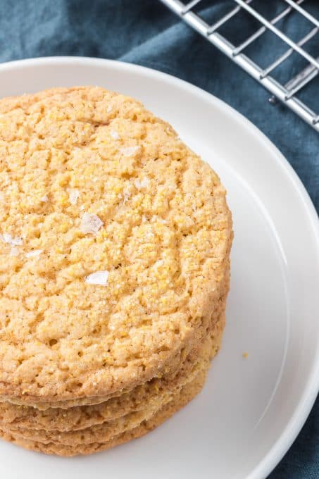 A close up of Maldon salt on a cookie made with cornmeal.