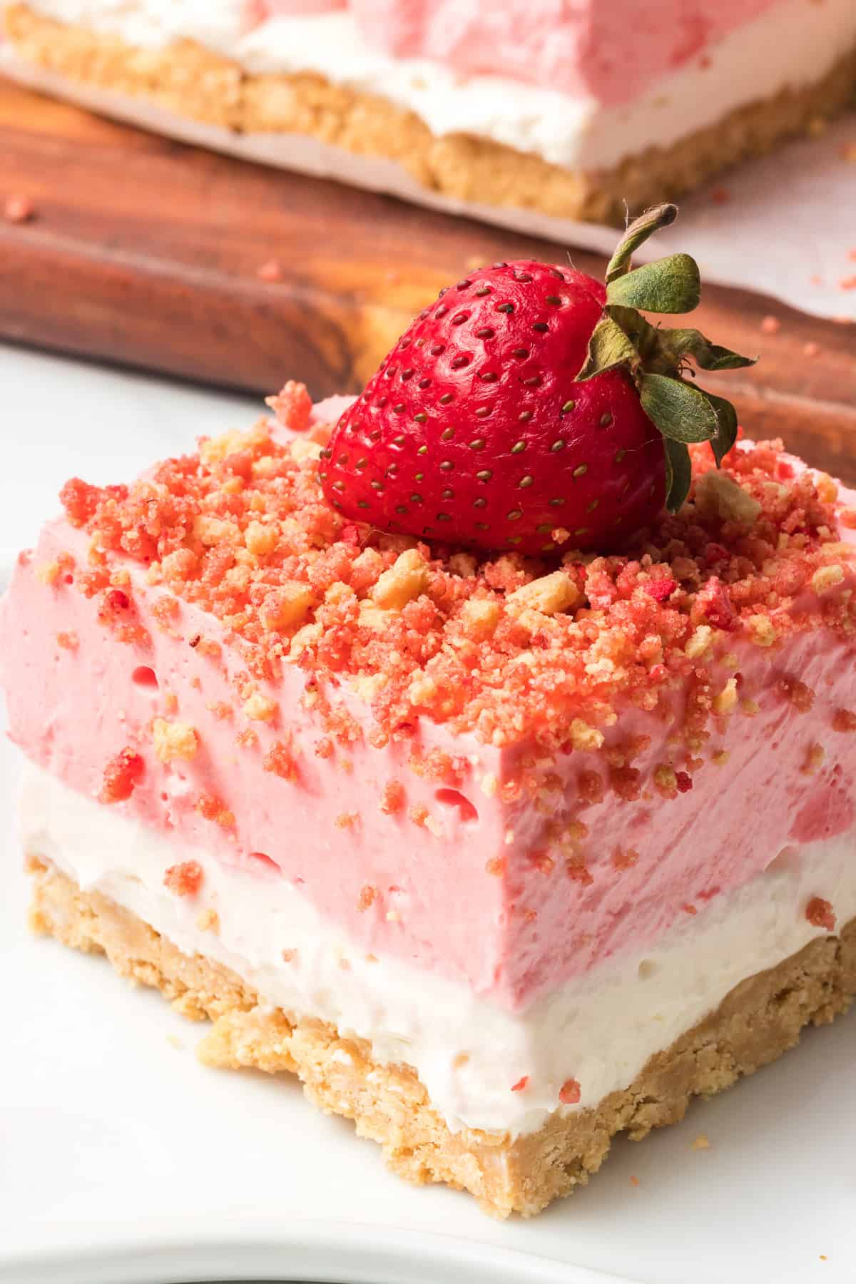 A Strawberry Shortcake Bar with a strawberry on top.