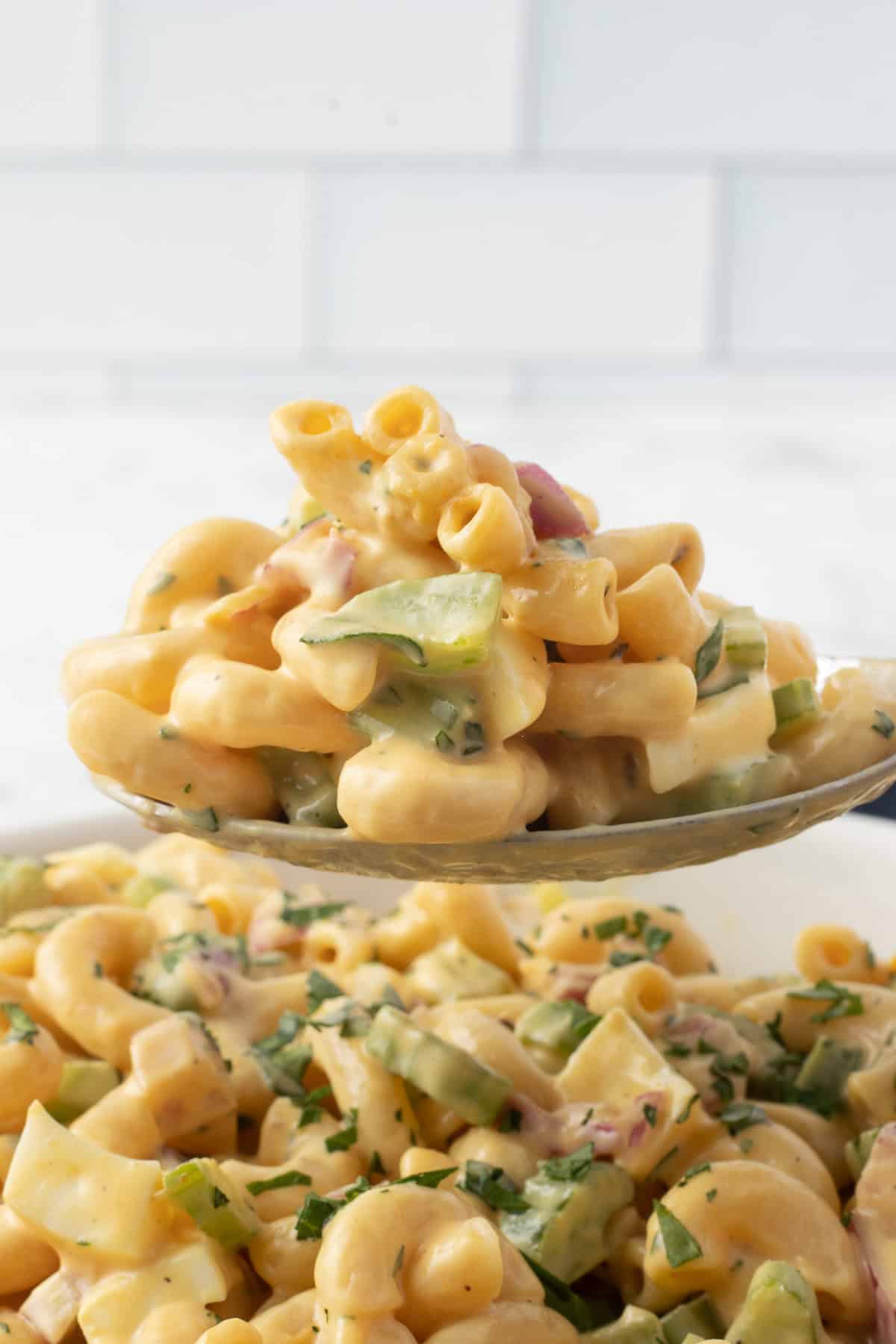 A bite of a pasta salad made with Chick-fil-A sauce.