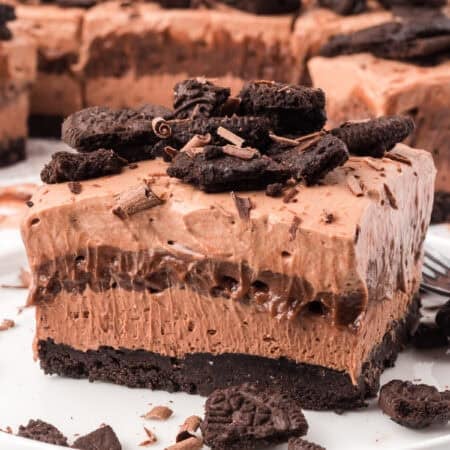 Chocolate layers on top of an Oreo crust on a plate.