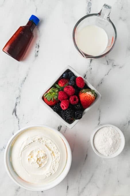 Ingredients for a Red, White, and Blue Cheesecake Salad.