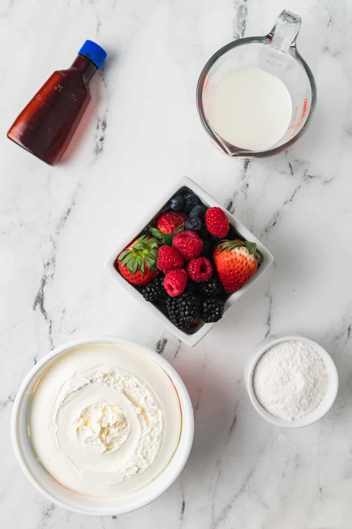 Ingredients for a Red, White, and Blue Cheesecake Salad.