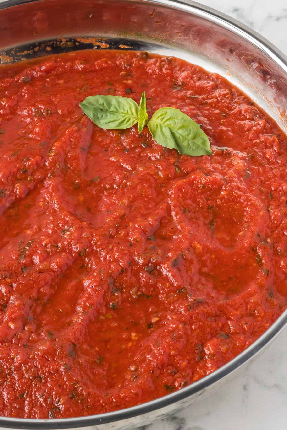 A skillet of homemade red gravy for Italian recipes.