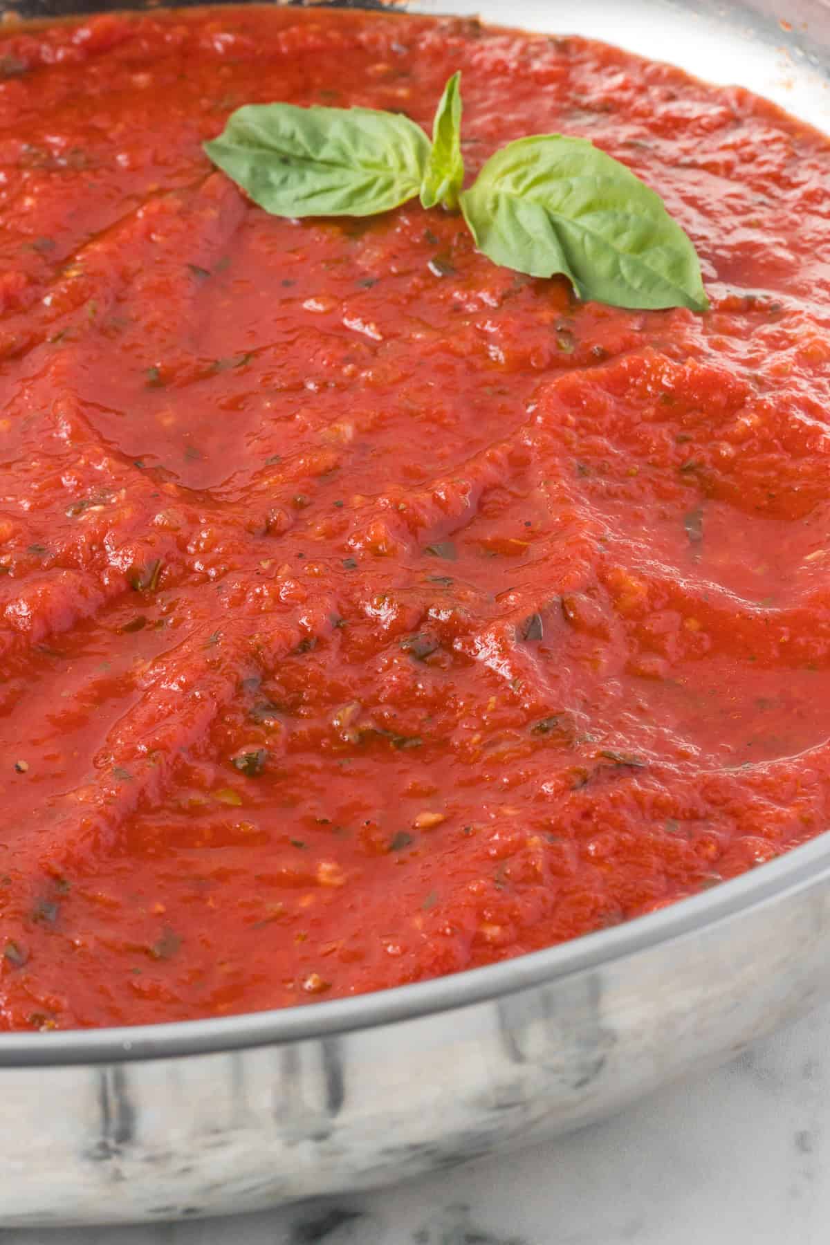 A skillet full of red gravy for pasta.