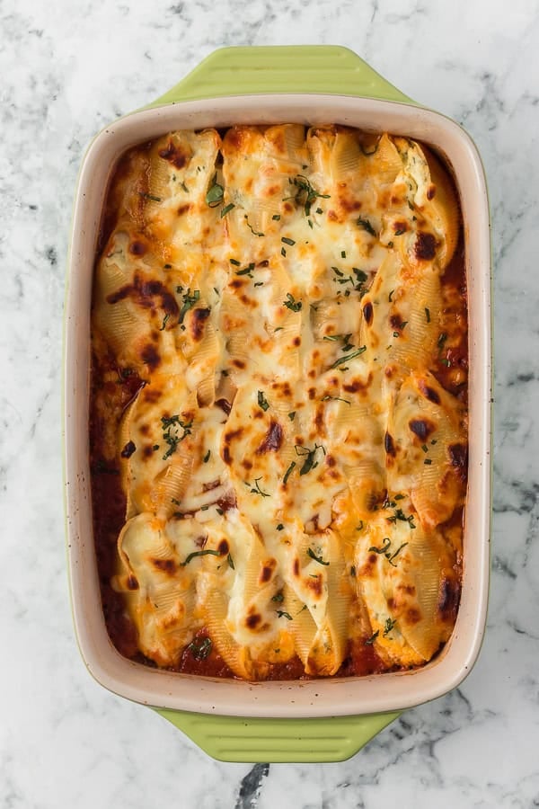 Baked Stuffed Shells in a baking pan.